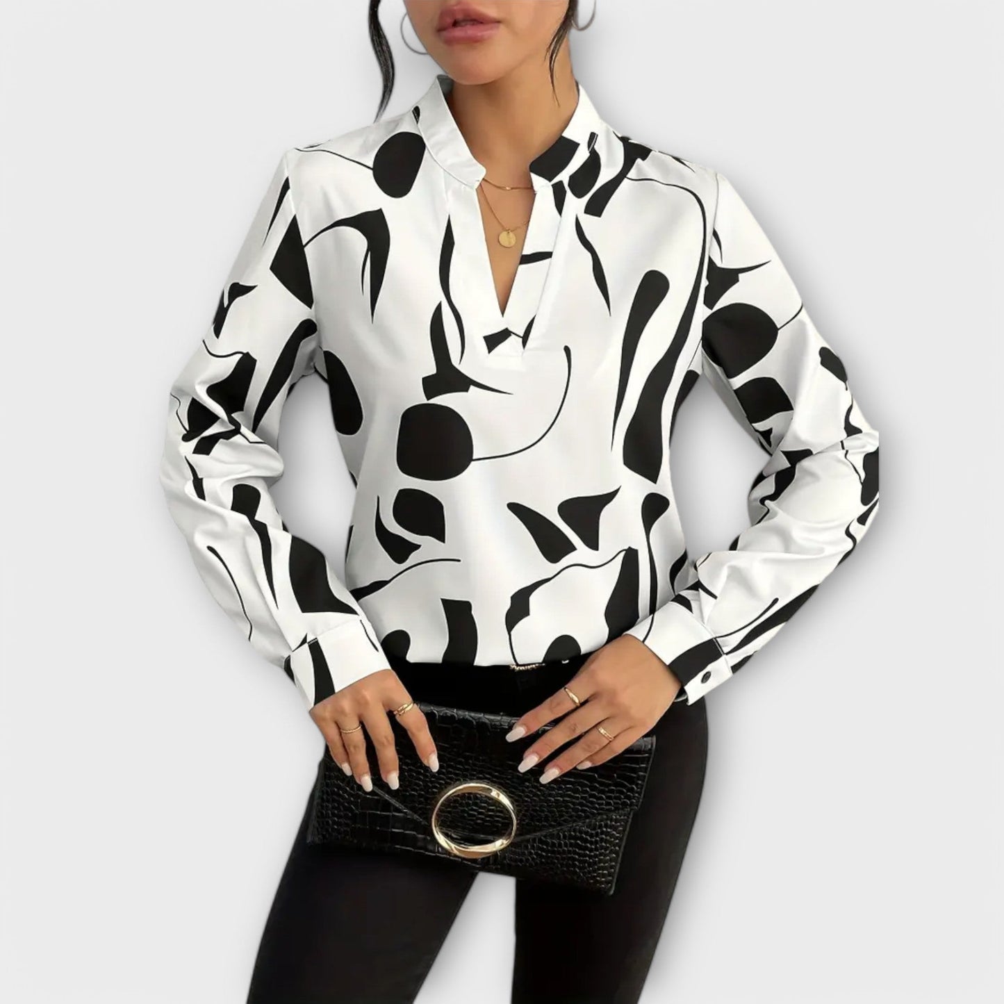 Elegant long-sleeved blouse with pointed neckline